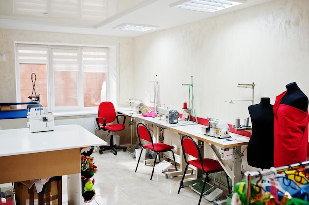 Workplace of seamstress office with sewing machine on table