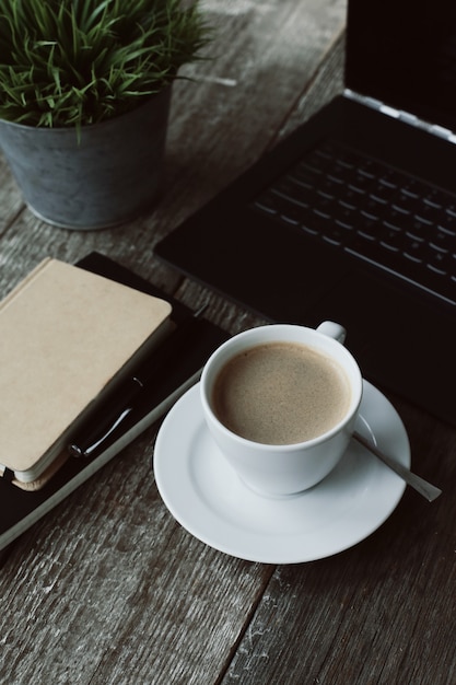 Workplace with computer and coffee cup