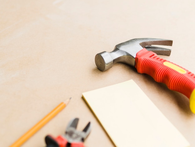 Workshop with hammer, pliers and plywood