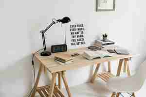 Free photo workspace with books and wooden table