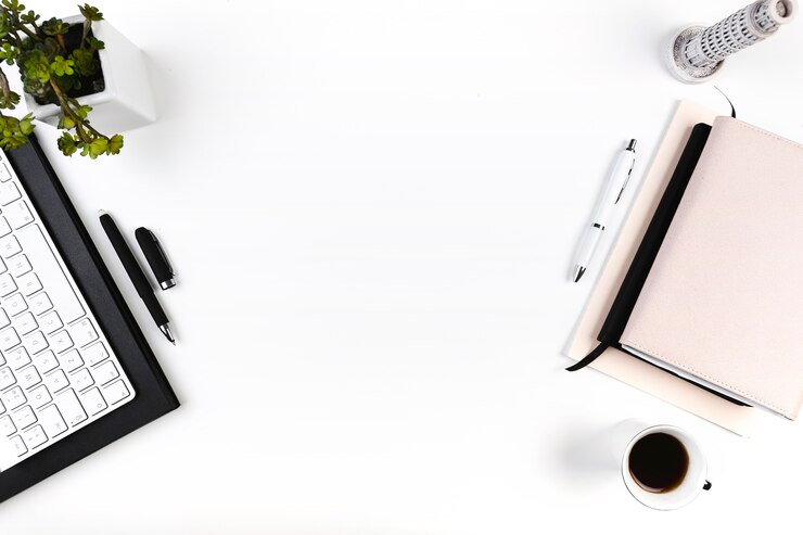 Free Photo workspace with keyboard and diaries