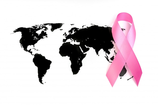 World cancer day : Breast Cancer Awareness Ribbon on world map .