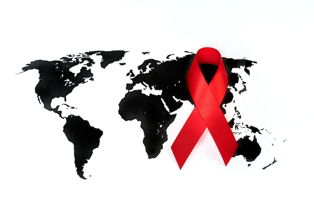 World cancer day : Breast Cancer Awareness Ribbon on world map .