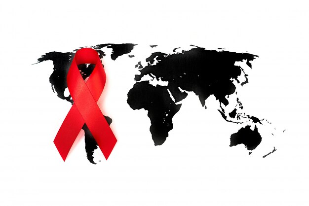 World cancer day : Breast Cancer Awareness Ribbon on world map .