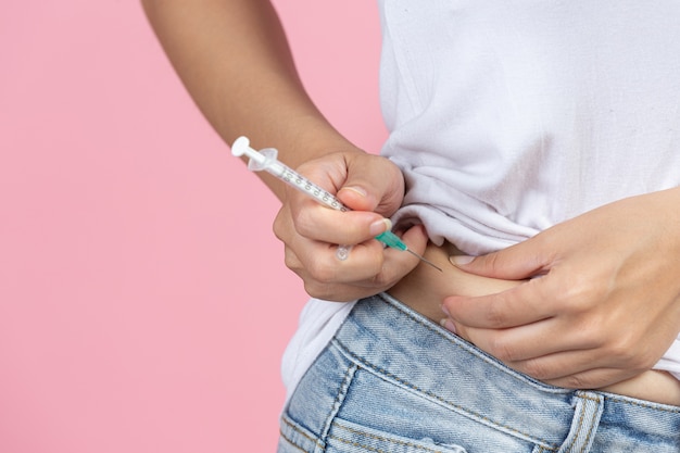 World diabetes day; close up picture of using medical device for check glucose in the blood.