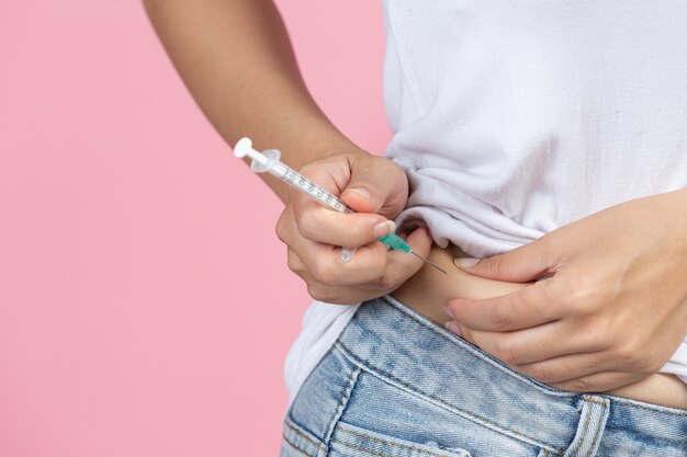 World diabetes day; close up picture of using medical device for check glucose in the blood.