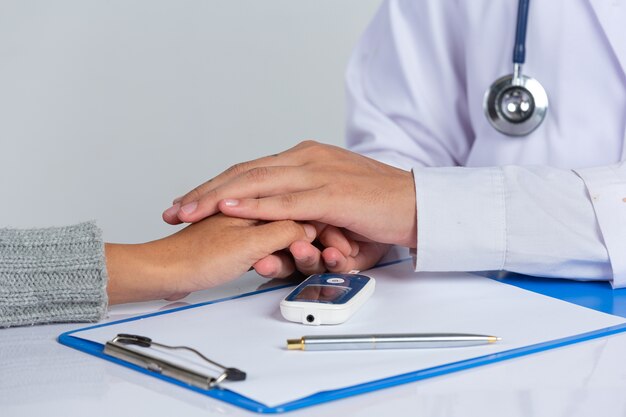 World diabetes day; doctor holding patient hand's