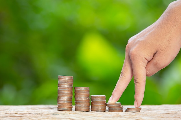 World habitat day,close up picture of a pile of coins and a hand