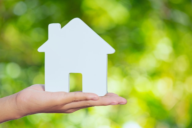 Free photo world habitat day,model house on hand