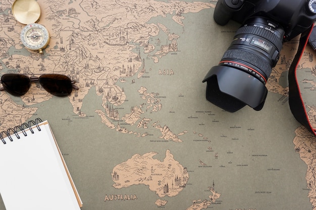 Free photo world map background with travel items