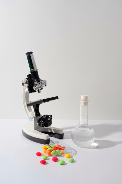 Free photo world science day arrangement with microscope and copy space