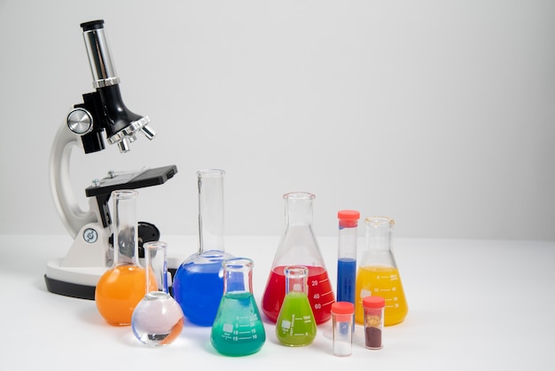 World science day arrangement with microscope and copy space