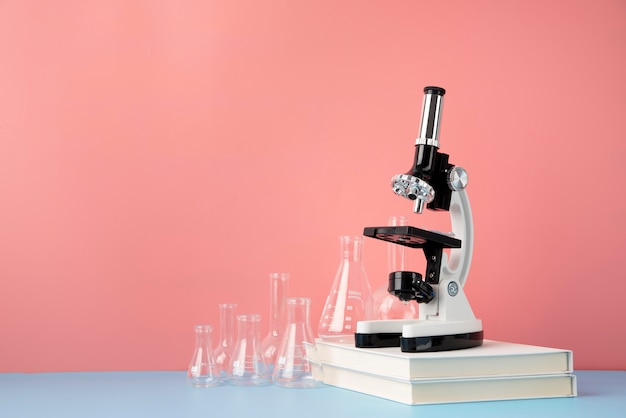 Free photo world science day arrangement with microscope and copy space