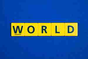 Free photo world word on yellow tiles