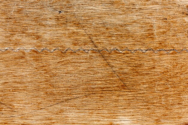 Worn wood surface with scratches