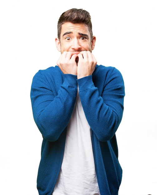 Worried man biting his nails