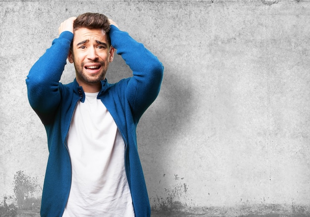 Worried man pulling his hair