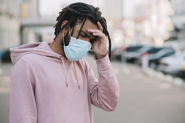 Worried man wearing medical mask