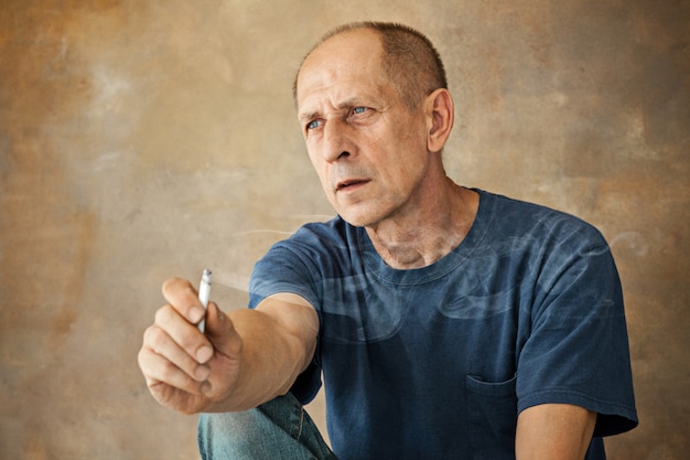 Free photo worried mature man sitting