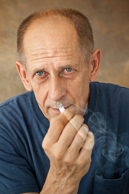 Worried mature man smoking