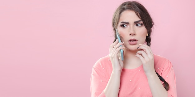 Worried woman talking on the phone with copy space