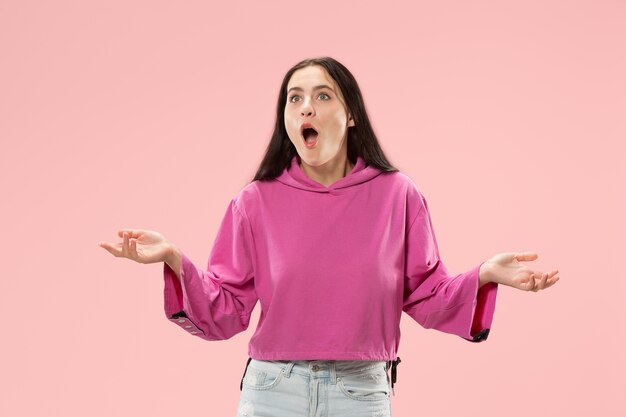 Wow. Beautiful female half-length front portrait isolated on pink studio