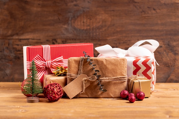 Wrapped christmas gifts on wooden table