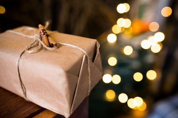 Wrapped gift and decorated with cinnamon sticks