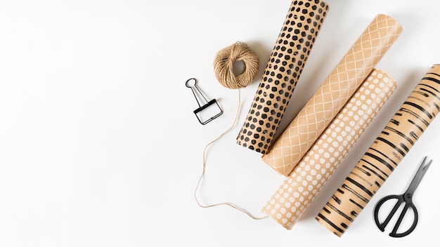 Wrapping paper rolls on white table 