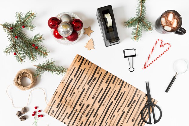 Wrapping paper with fir tree branches on table