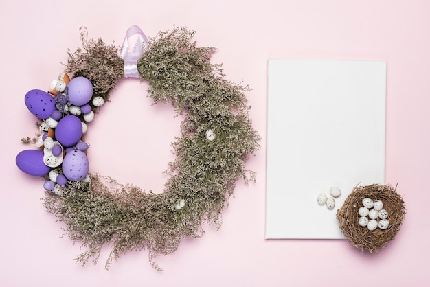 Wreath of Easter eggs and flowers with paper