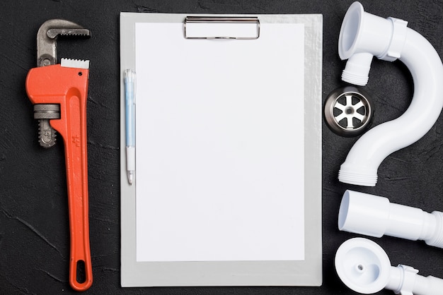 Free photo wrench and connectors with clear paper