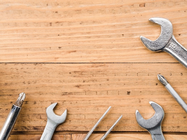 Wrenches, forceps and screwdrivers on table