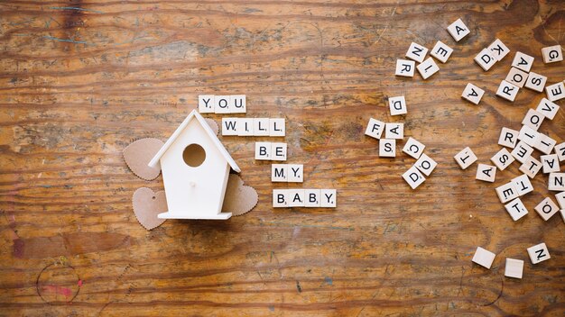 Free Photo Writing About Coming Baby Near Wooden House