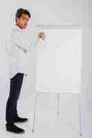 Free photo writing onwhiteboard an posing