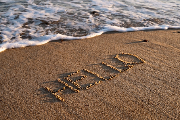 Free photo writing words in the sand