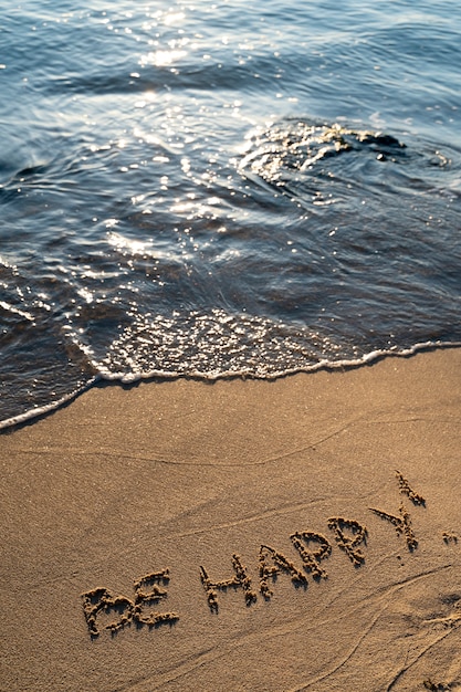 Free photo writing words in the sand