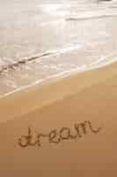 Free photo writing words in the sand