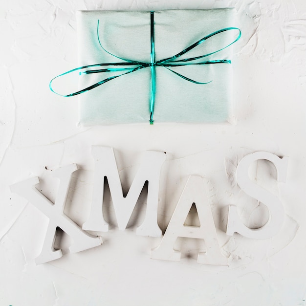 Xmas inscription with gift box 