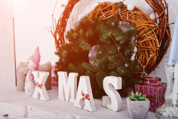 XMas word decor with wreath Happy winter holidays concept