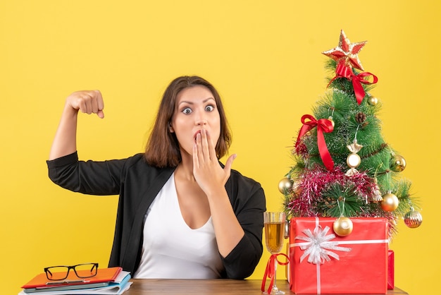 Xsmas mood with young serious emotional nervous shocked business lady