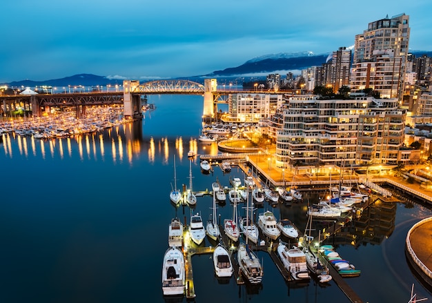 Yachts on Body of Water Near City