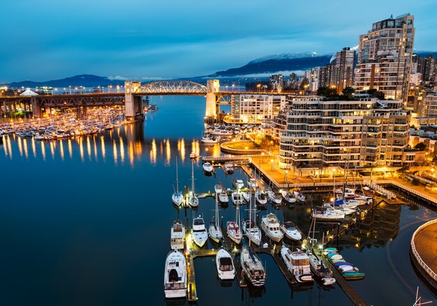 Yachts on Body of Water Near City