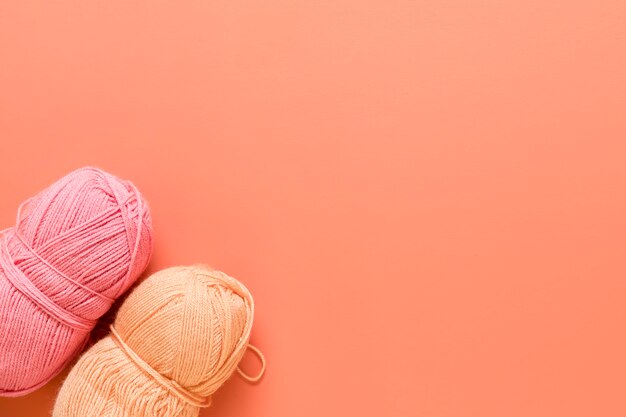 Yarn for knitting on orange background