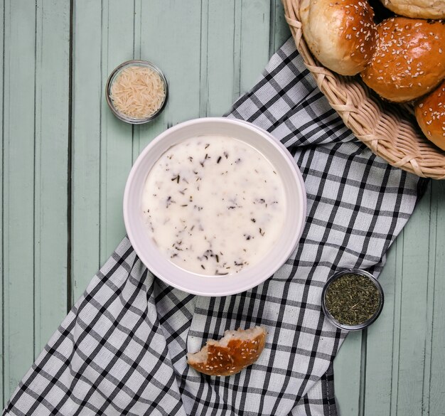 Yayla soup in a white bowl with spices.