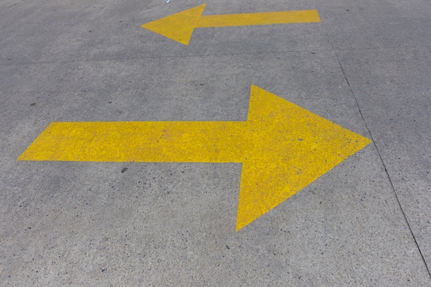 Yellow arrows in a parking lot high view