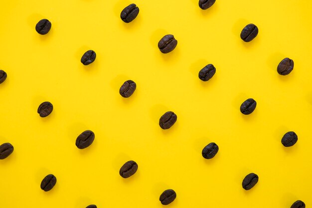 Yellow background with coffee beans