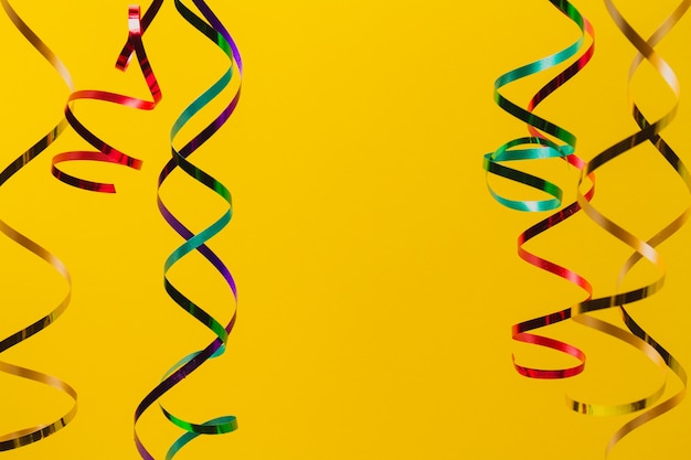 Free Stock Photo: Yellow Background with Colorful Ribbons