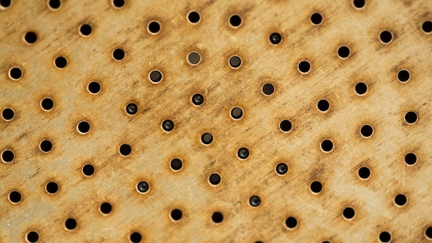 Free photo yellow background with holes