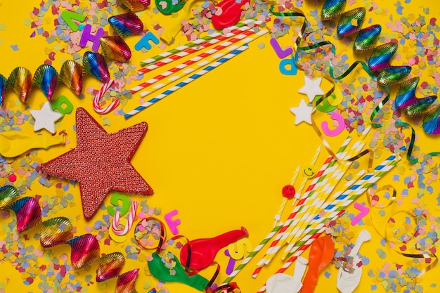 Yellow background with a red star and party decoration